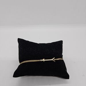 Stella & Dot gold tone and yellow drawstring bracelet with arrow charm